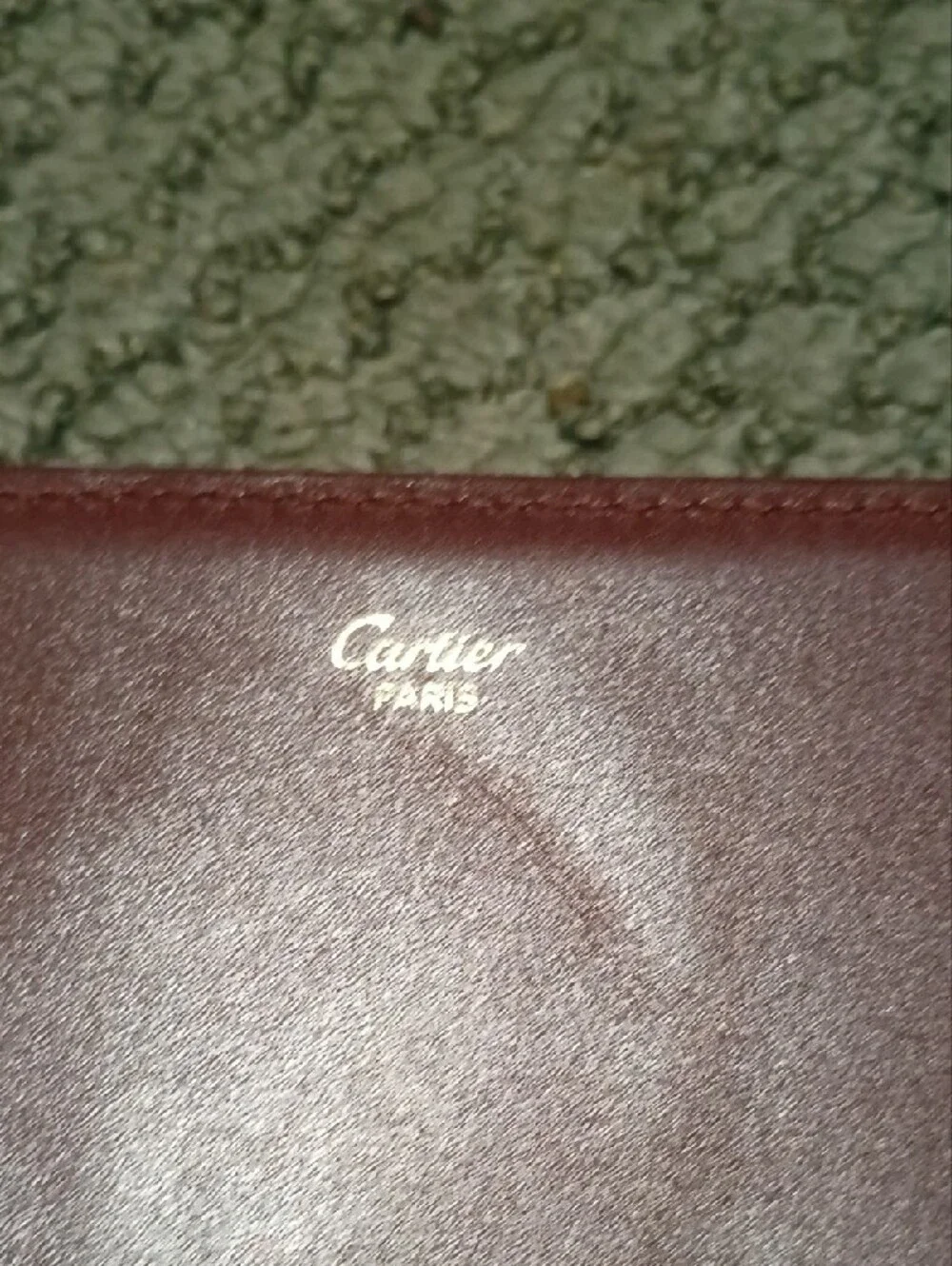 Cartier- Leather Fold-Over Clutch in Burgundy with Gold Accents